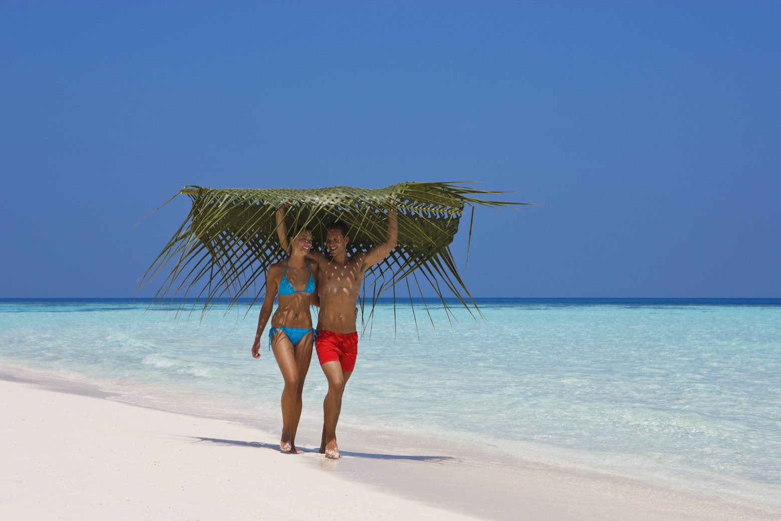 Strand bij Vilamendhoo Resort op de Malediven