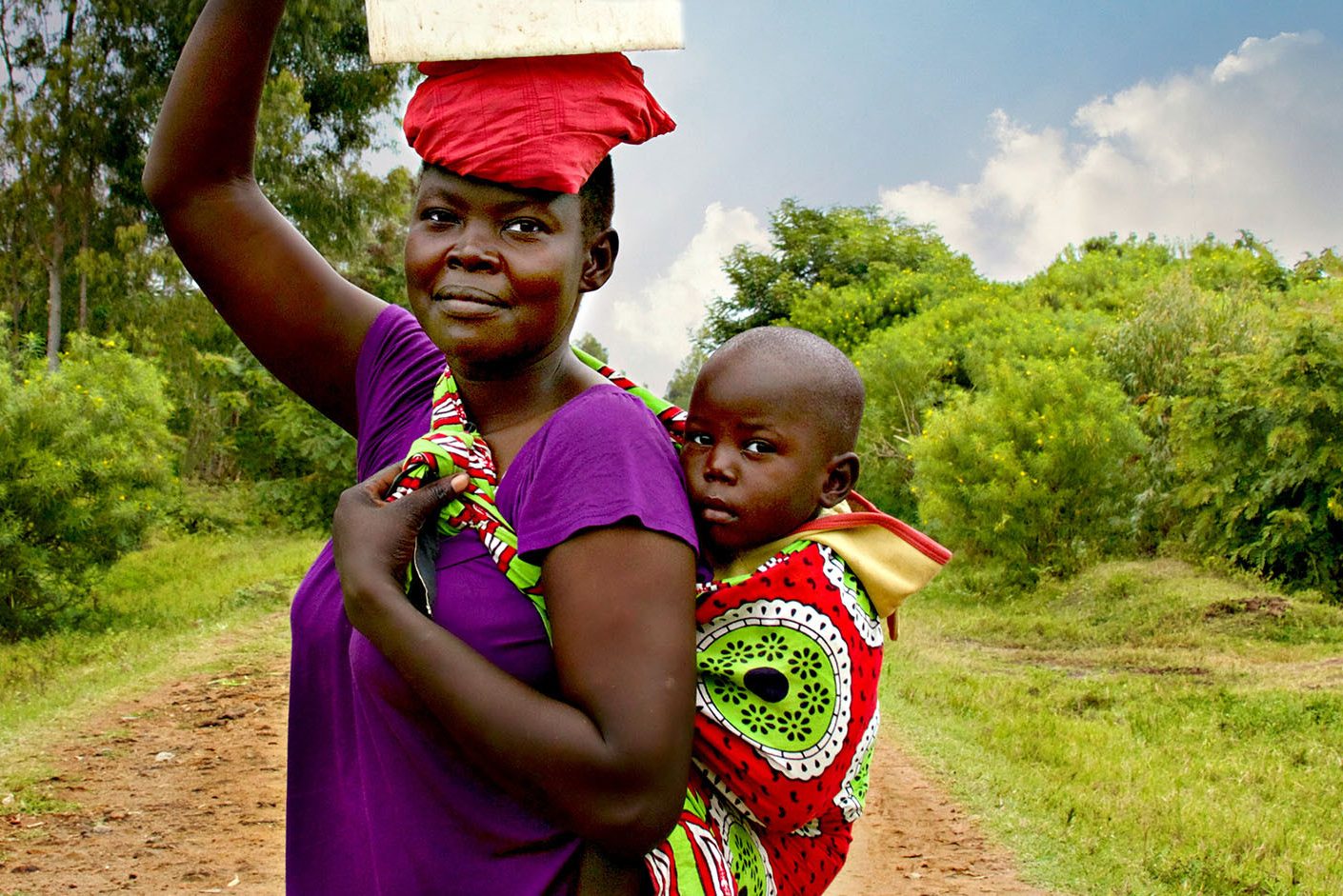 Vrouw met kind in Uganda