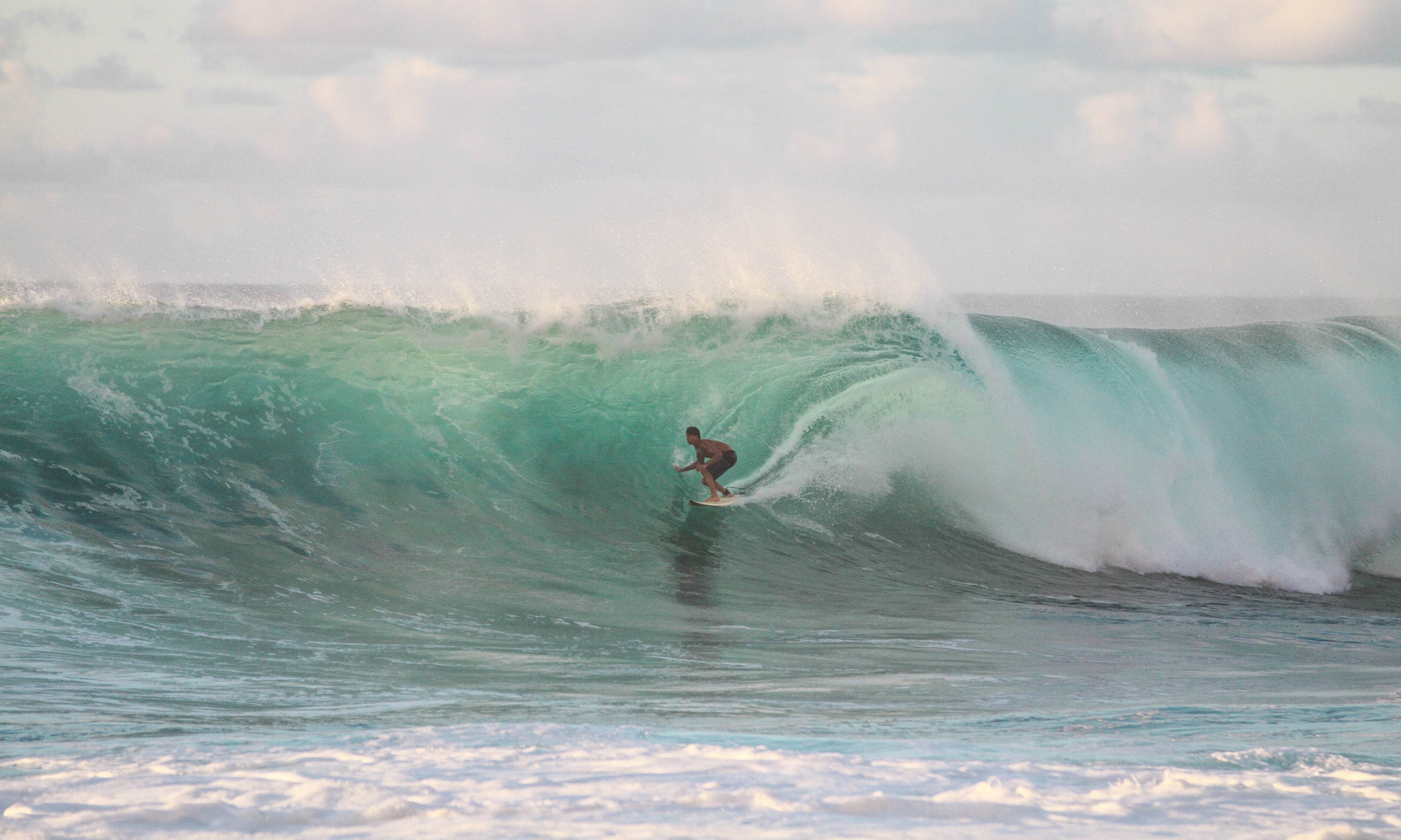 Surfer in North Shore Oahu HAwaii